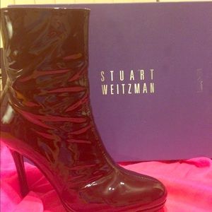 Stuart Weitzman patent leather stiletto boots.