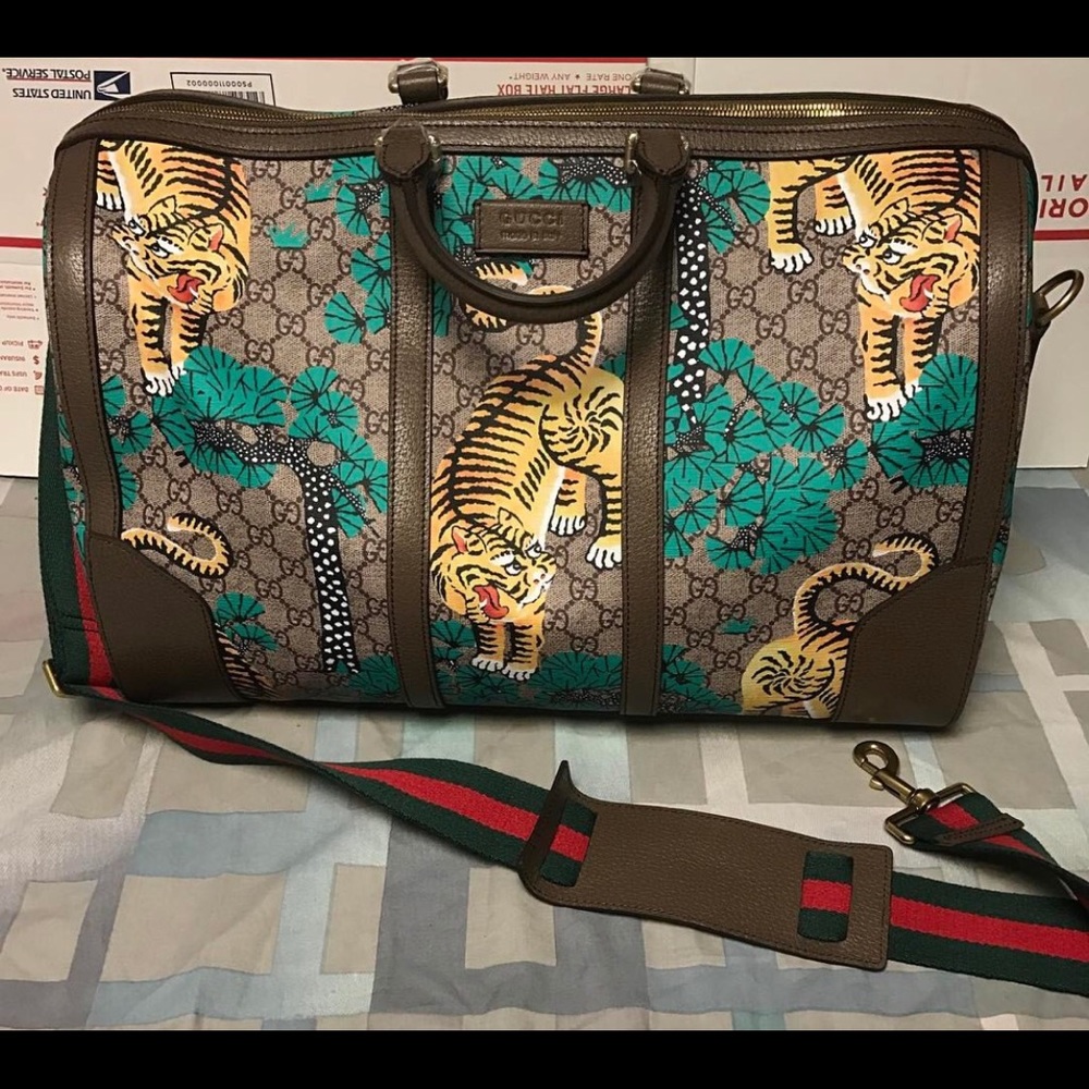 Authentic Gucci traveling bag, phone case,and belt