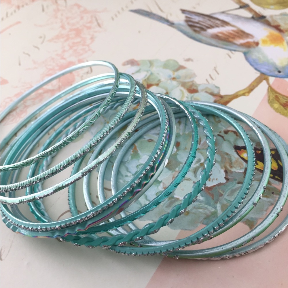 11 teal braclets NEW, never worn