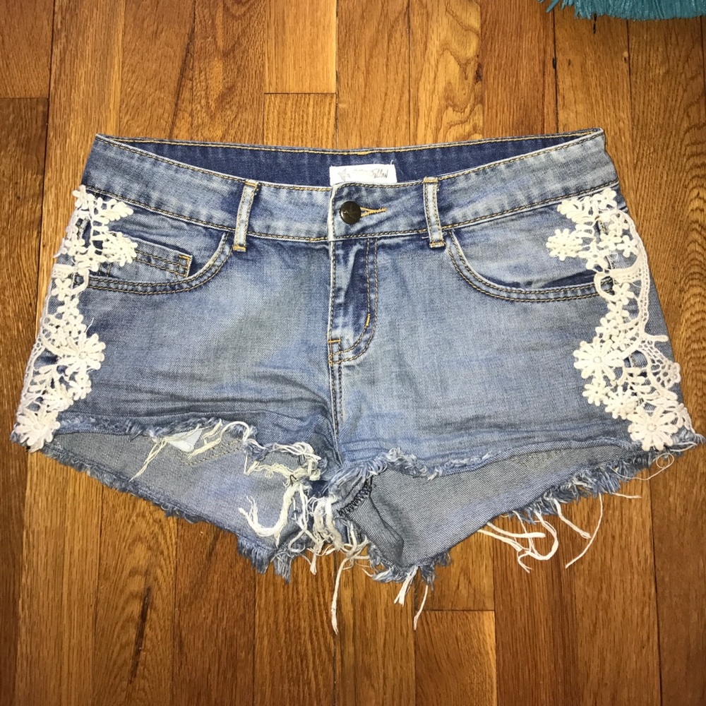 Tilly's distressed shorts with lace along the side