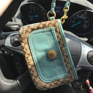 Teal and beige Coach wristlet/clutch