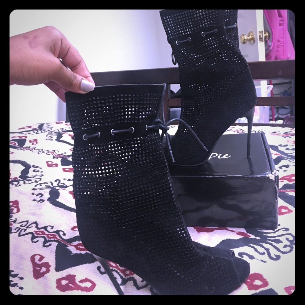 Black laser cut peep toe booties