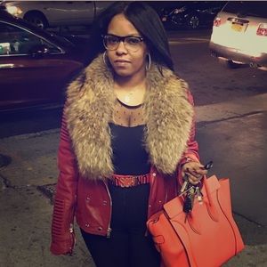 Red leather motorcycle jacket with fox fur collar