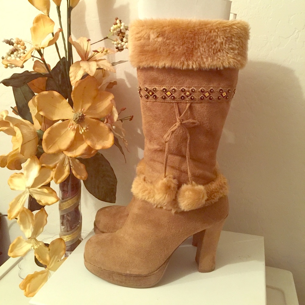 Tall light brown boots.