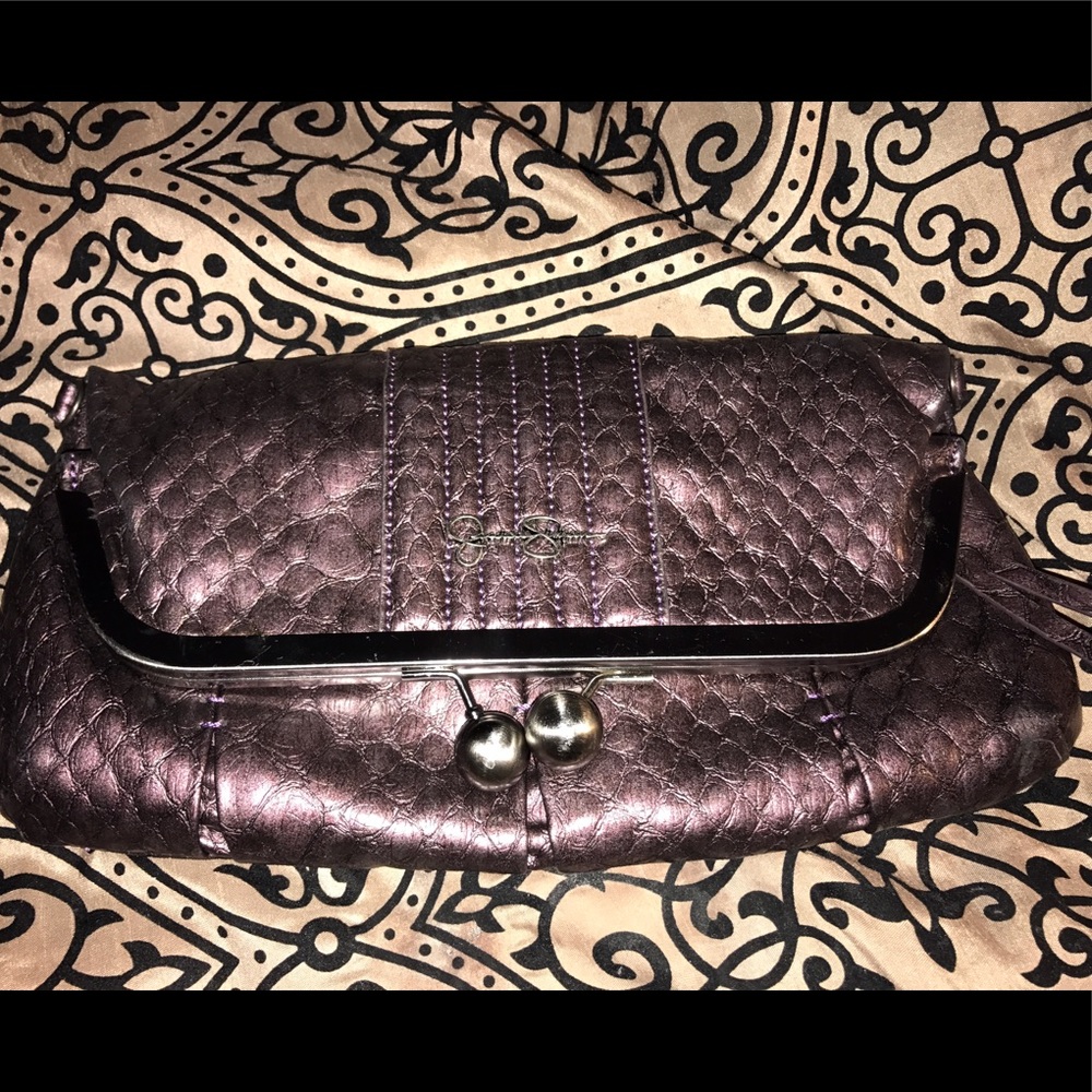 Purple clutche purse that doubles into a crossbody