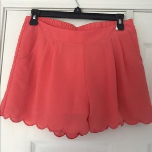 High waisted coral shorts with scalloped bottoms