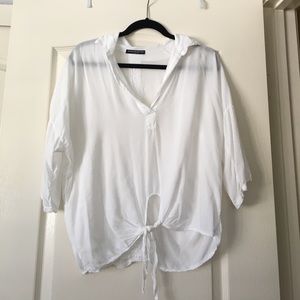 Brandy Melville white flowy shirt.
