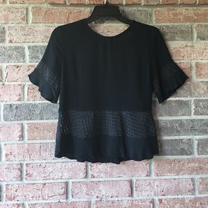 Black crop top by DO+BE.