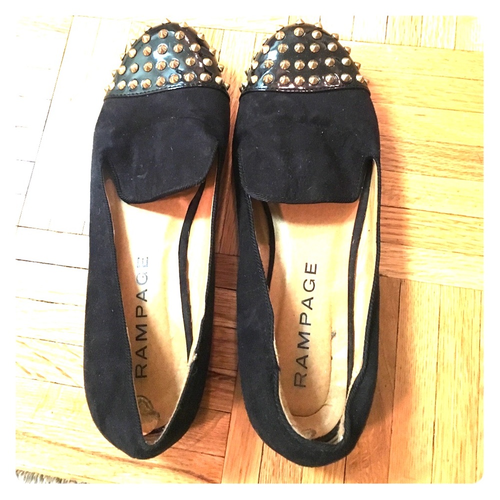 Black flats with gold studs on toes