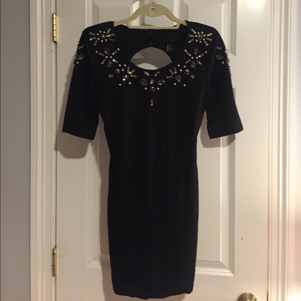 Fun and flirty open back black dress
