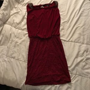 Open back burgundy dress.