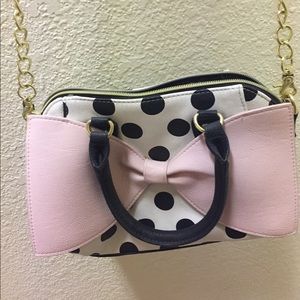 Betsy Johnson polka dot purse with pink bow.