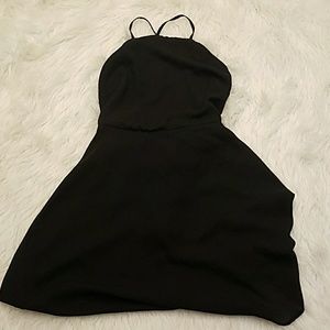 Black high-neck skater dress with exposed back