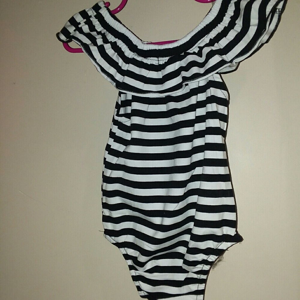 Off the shoulder baby romper.