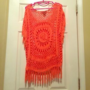 Orange knitted shirt with fringe