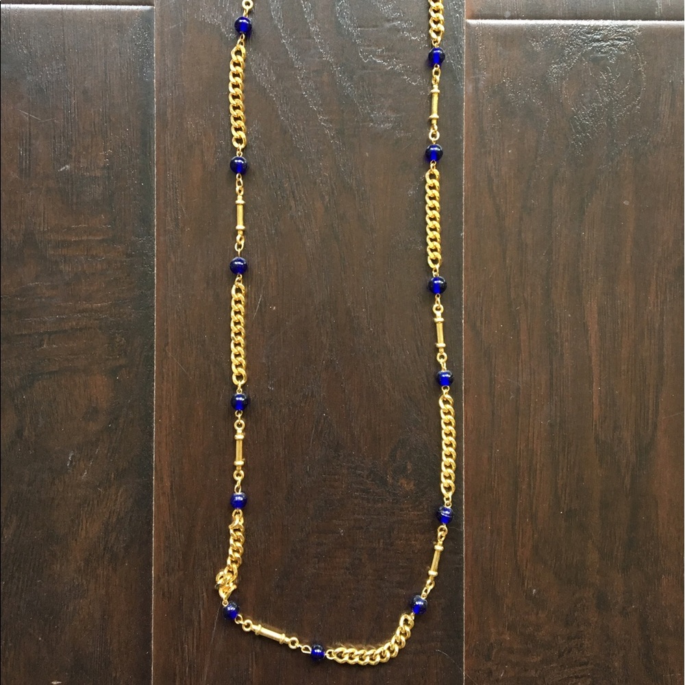 Long gold and blue necklace.
