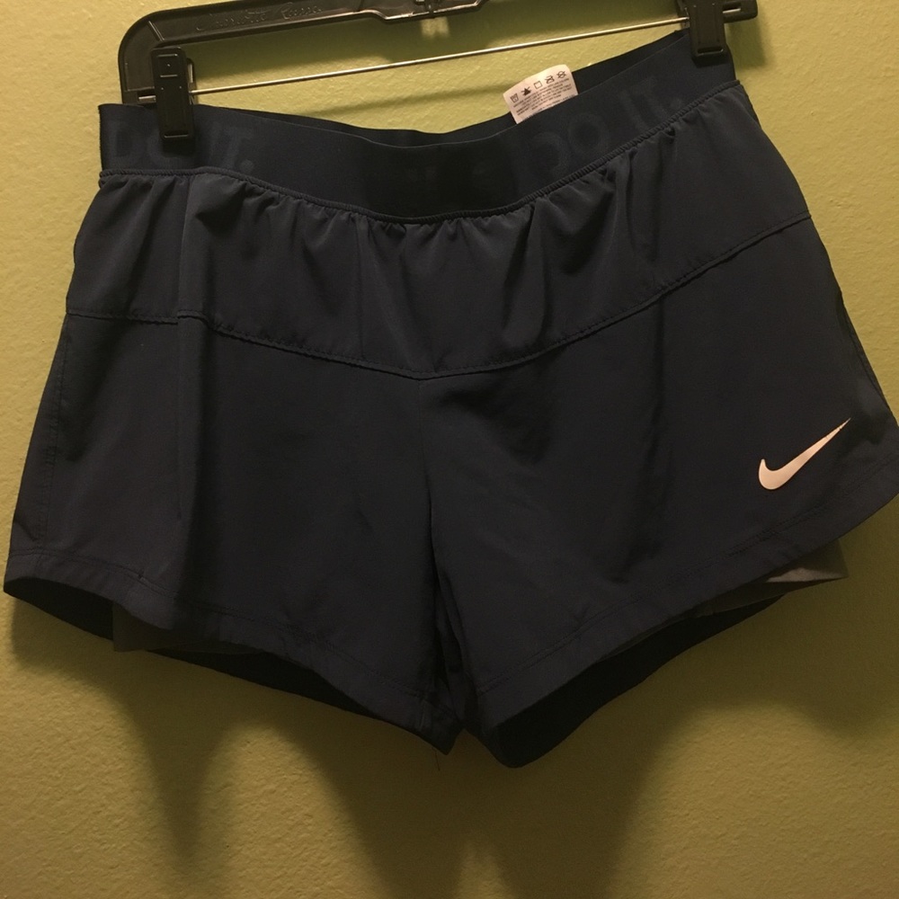 Navy blue nike shorts with gray spandex size:M