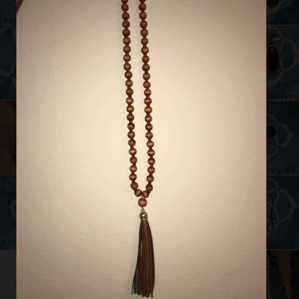 Long brown beaded necklace with tassel