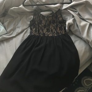 Black flow mini dress with lace overlay