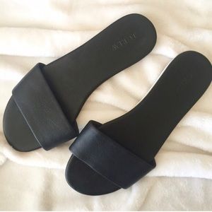 Black leather slides