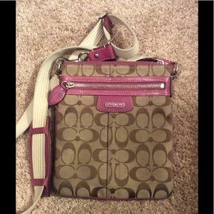 Crossbody Coach purse with lavender trim