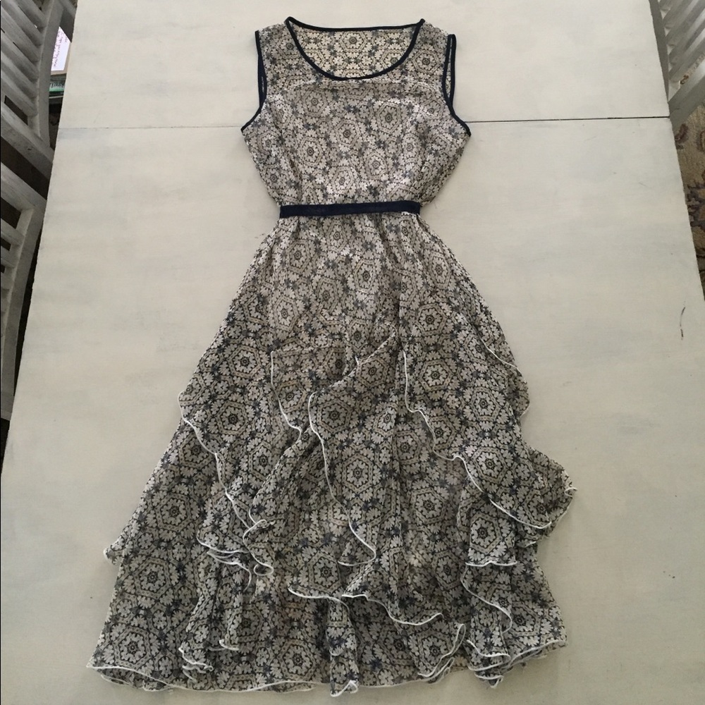 Fun navy, blue, and yellow pattern on cream dress