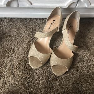 Gold high heel shoes