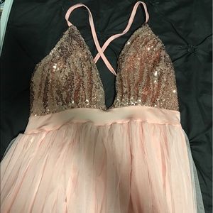Rose gold colored, sequined maxi dress.
