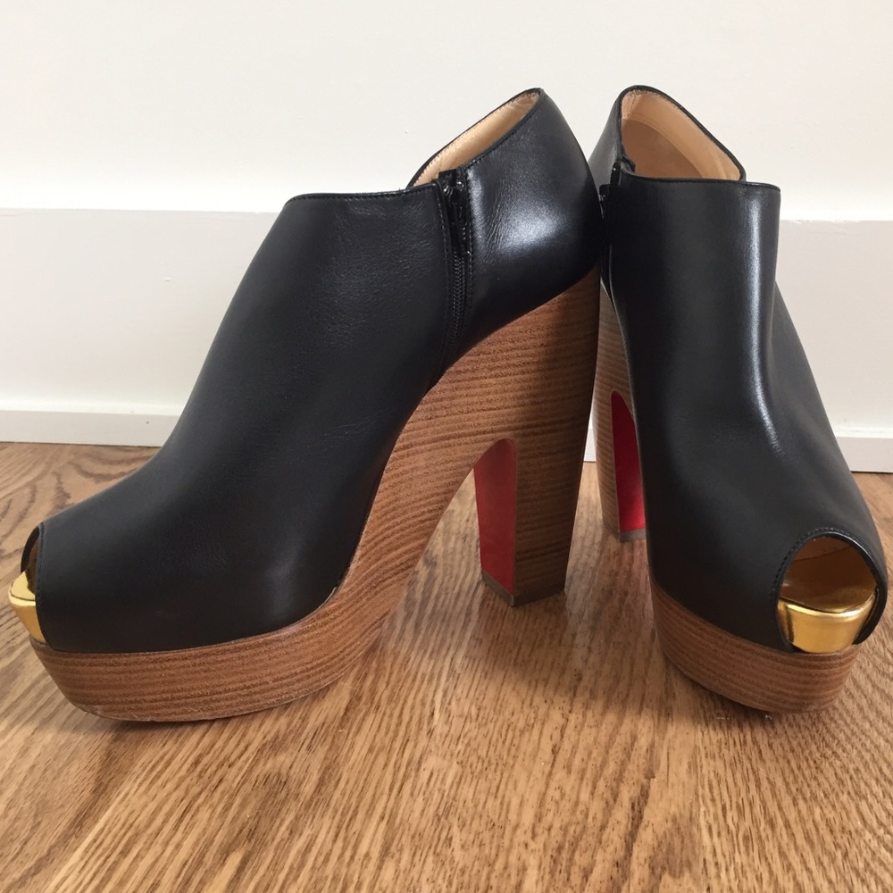 Christian Louboutin black leather platform heels.