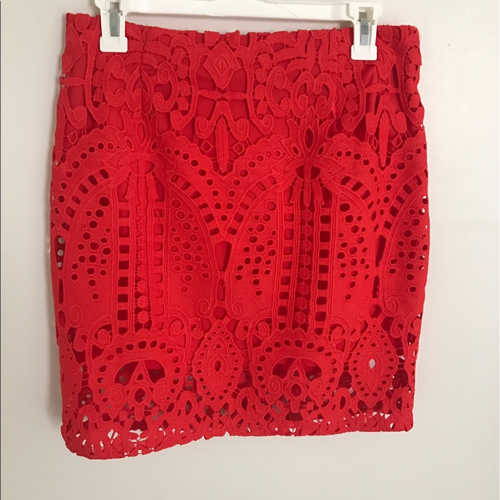 Red eyelet overlay skirt