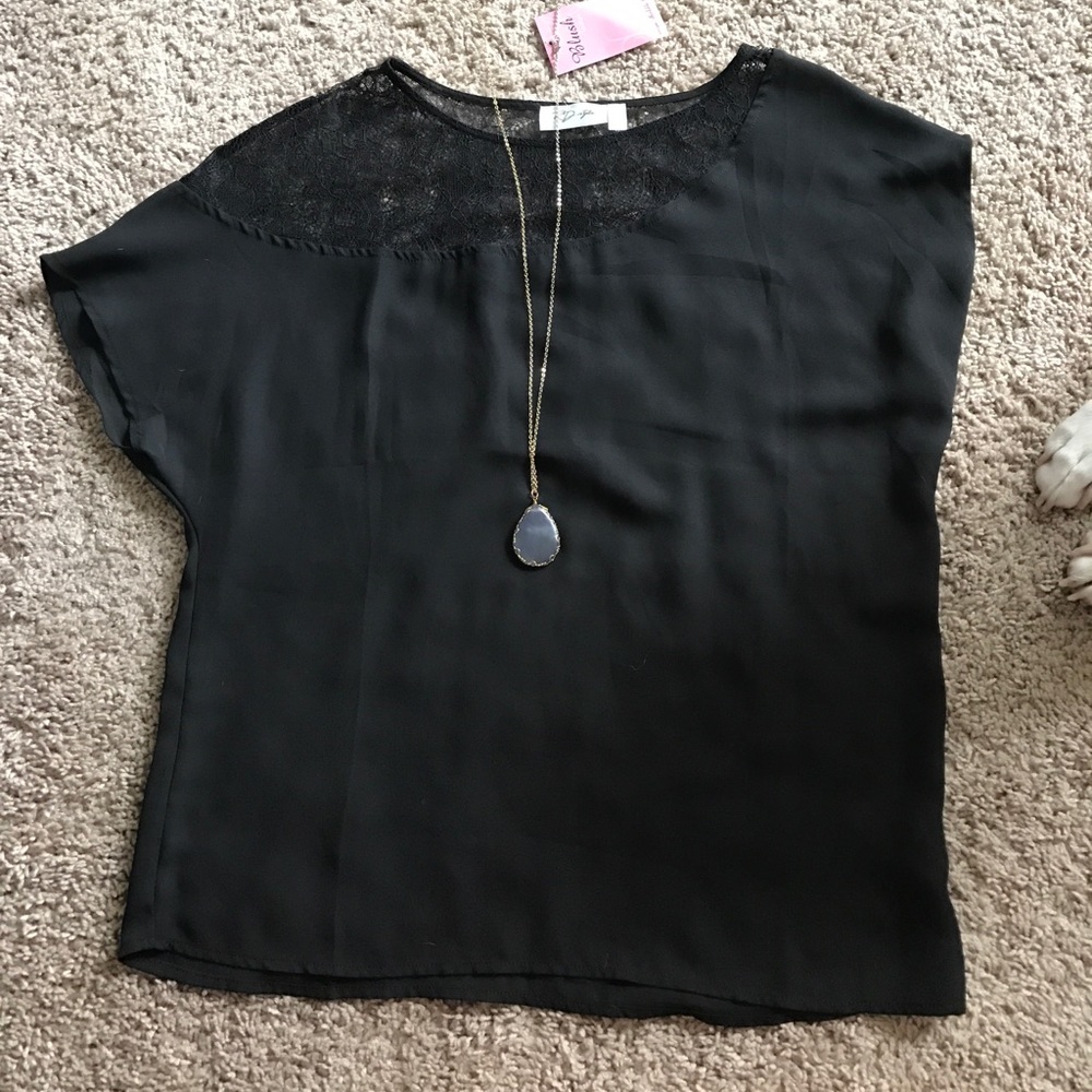 Black sheer blouse with lace embellishments