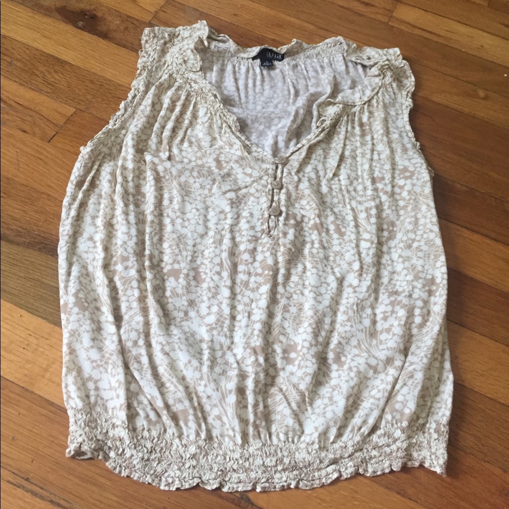 Cream sleeveless blouse