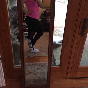 Brand new Pink Leggings with cutouts (size M)