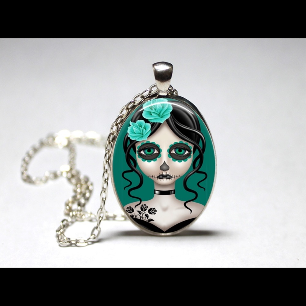Day of the dead blue flower girl pendant.