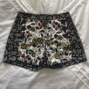 Anthropologie printed shorts with sailor buttons.