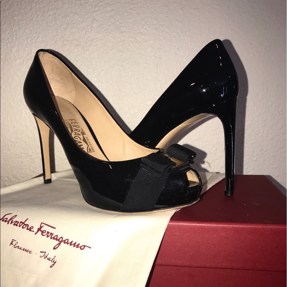 Patent leather Ferragamo peep toe pumps.