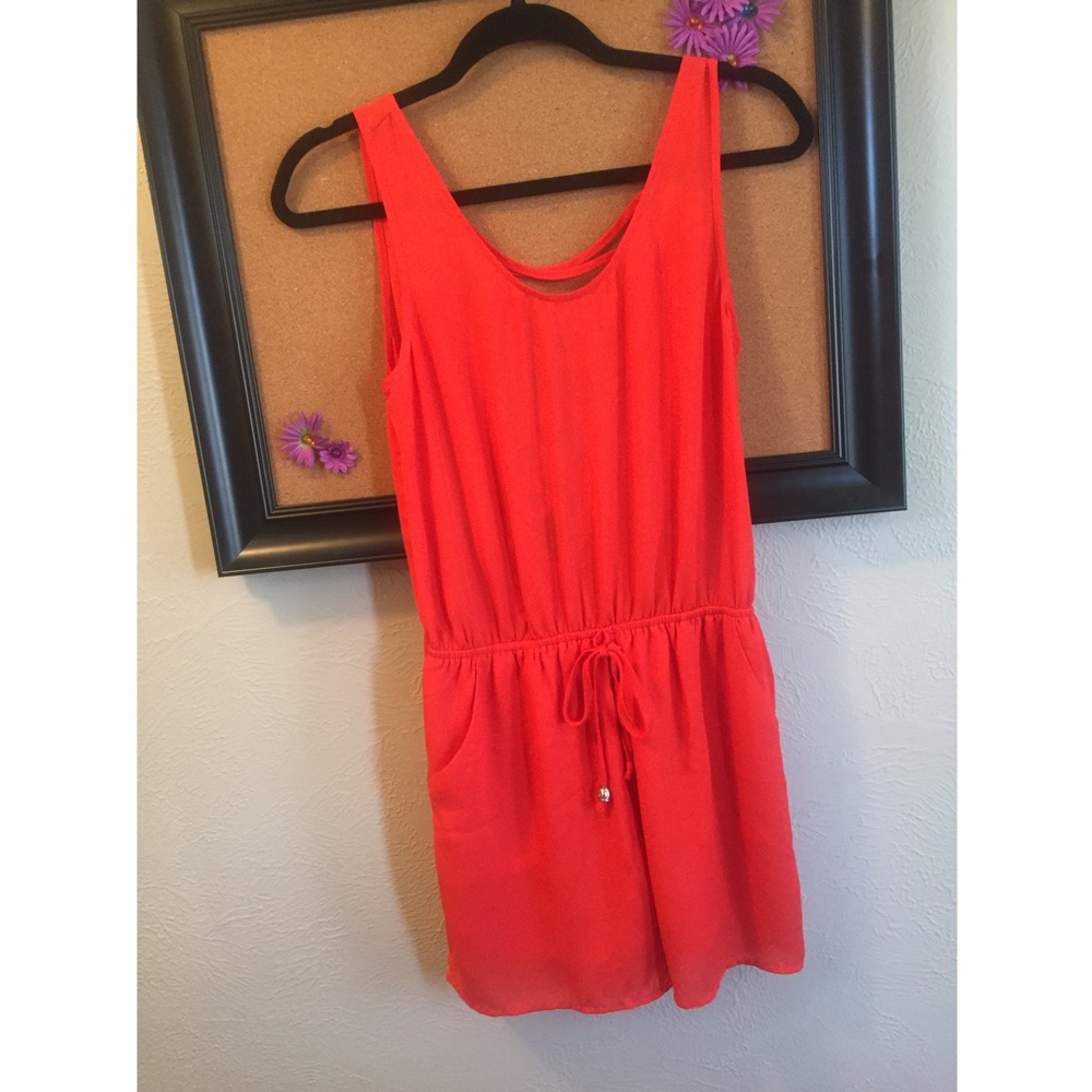 Tangerine romper with semi open back