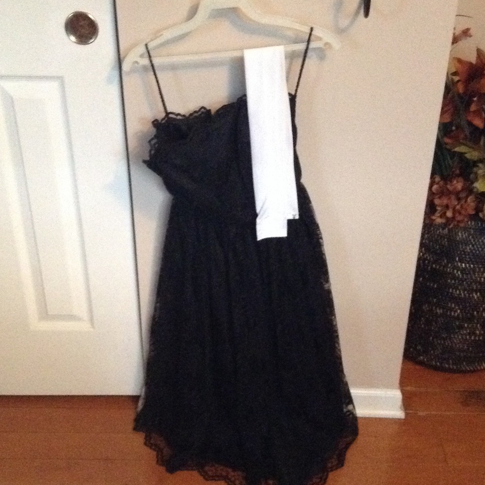 Black lace dress with white satin scarf