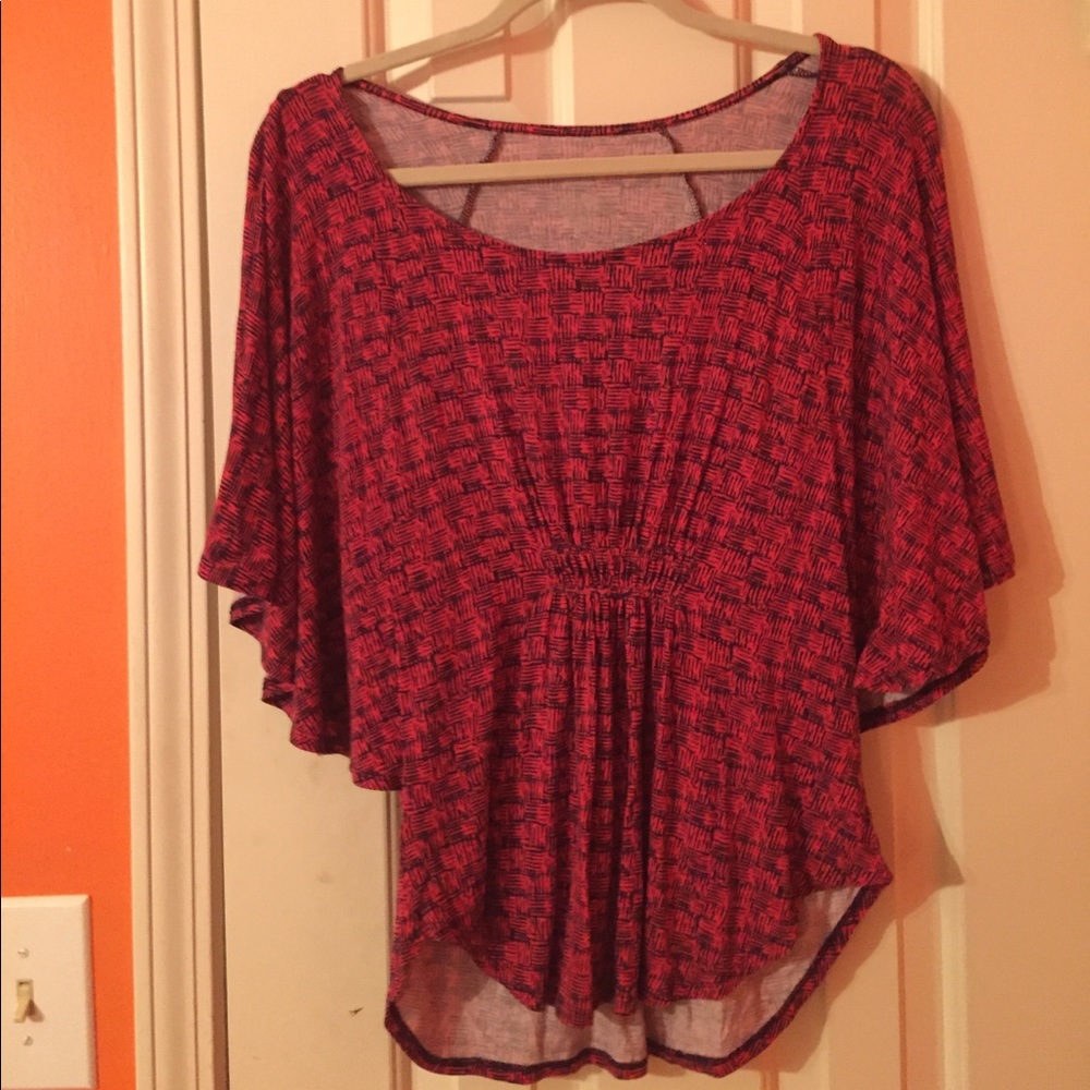 Red and navy fitted shirt with flowing sleeves