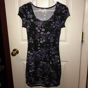 Brand new tight fitting short dress with floral