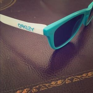 Teal & White Oakley sunglasses