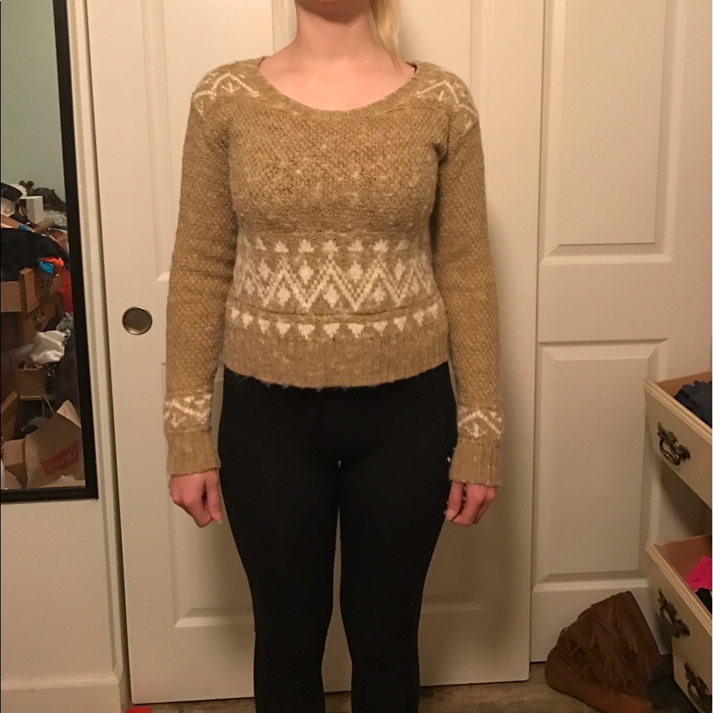 Tan and white sweater with Aztec patterns