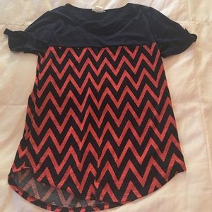 Navy and orange chevron top.