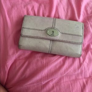 Light purple distressed leather Fossil wallet.