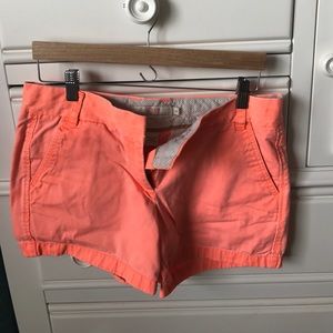 Show off that summer tan. Neon orange jcrew shorts