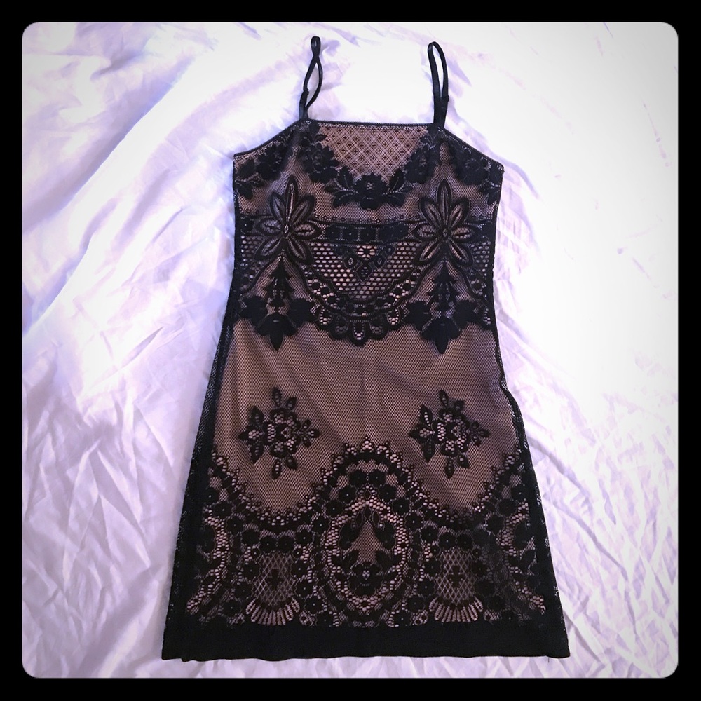 Lace slip dress with nude backing