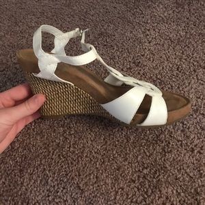 White wedge heel sandals.