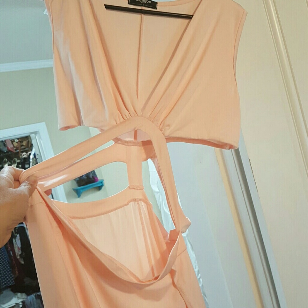 Peach colored maxi dress with tummy cut outs. Larg