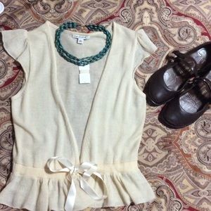 Super cute ruffled wrap blouse. 100% wool, cream
