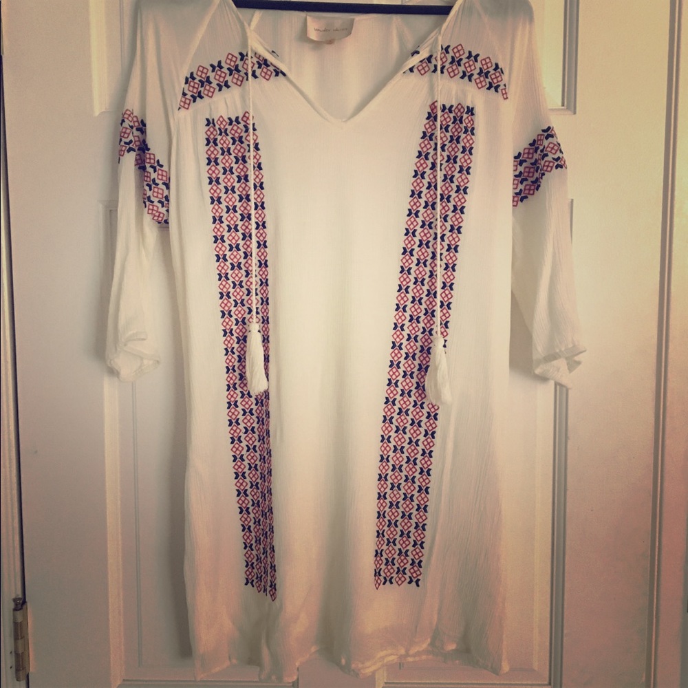 White dress with red and blue embellishments